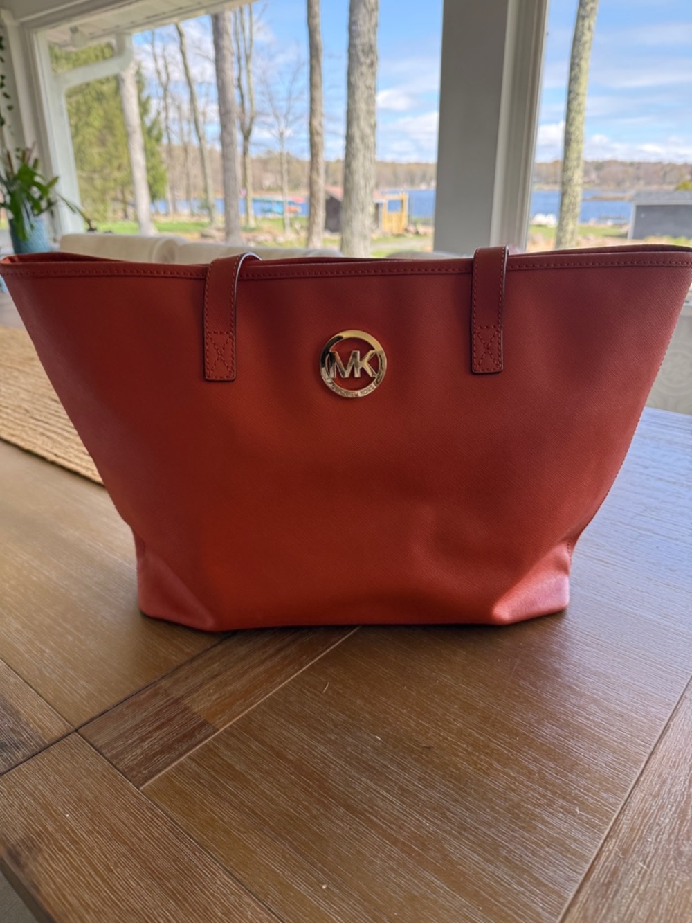 Michael Kors orange Tote with MK Medallion with matching trifold wallet